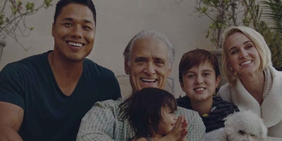 A multigenerational family sitting on the porch of their home in Scottsdale